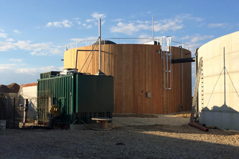 Bert Energy biogas tank with wood cladding, farm installation